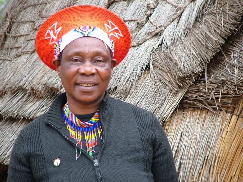a married zulu woman wearing an izicolo, shakaland, kwazulu-natal, south africa