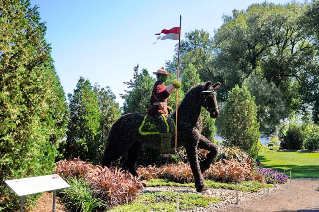 a royal canadian mounted police on horseback, mosaiculture 2018, gatineau, quebec, canada