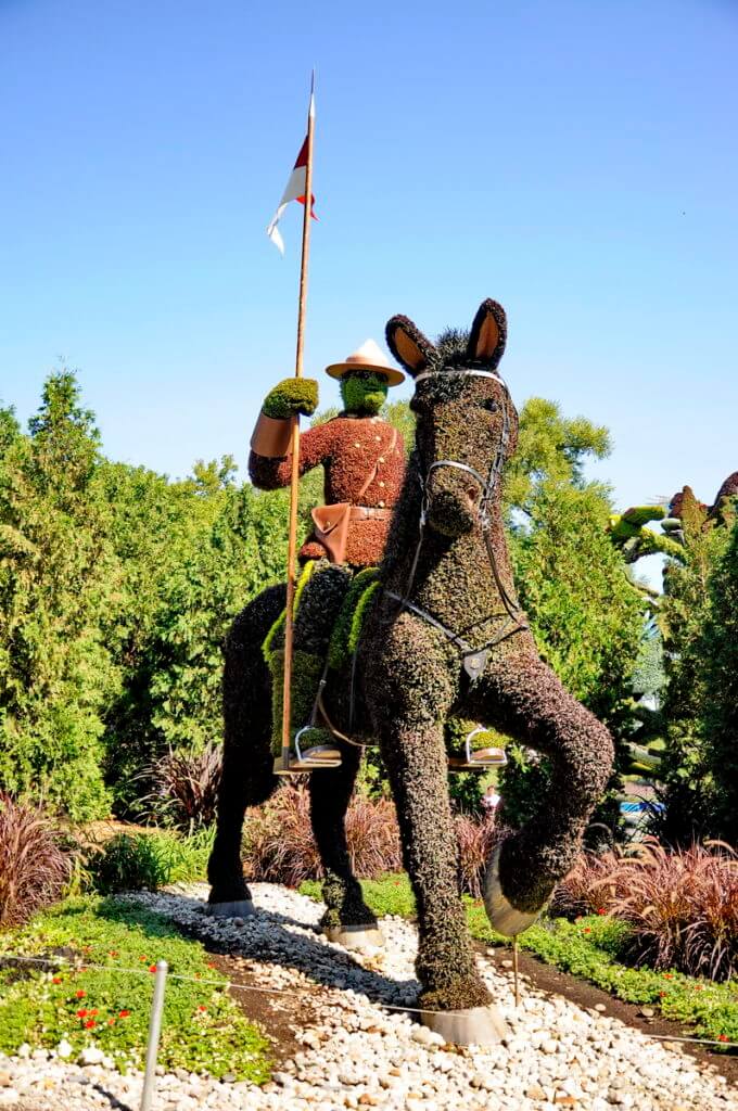a royal canadian mounted police on horseback, mosaiculture 2018, gatineau, quebec, canada