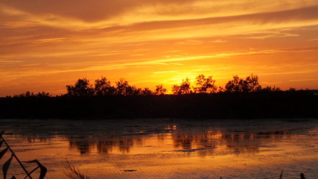 orange sky over the wetlands, Parco Regionale Veneto del Delta del Po (The Regional Park of the Po River Delta), italy