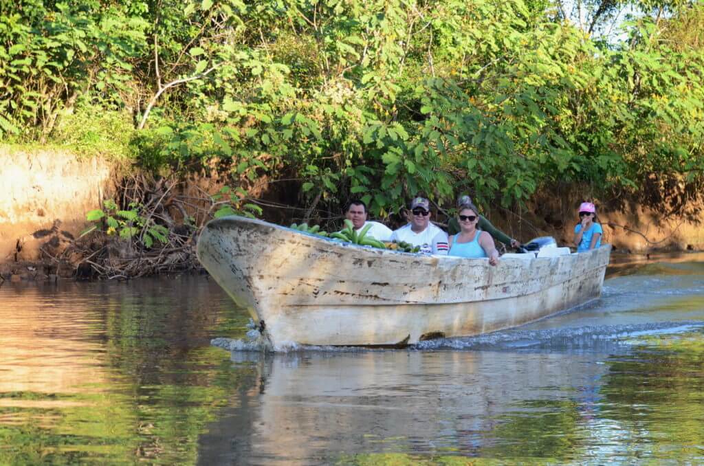 villagers with a boatload of plantain, cano negro wildlife refuge, costa rica