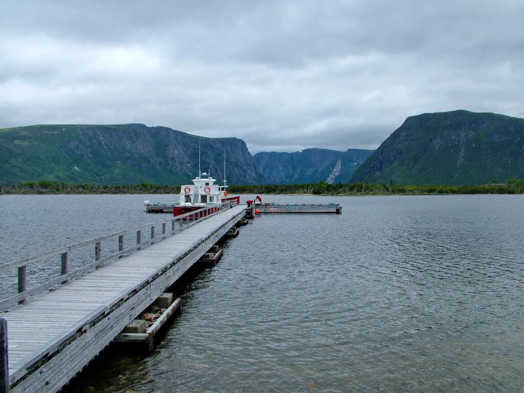 tour boat and dock on western brook pond, gros morne national park, newfoundland, canada