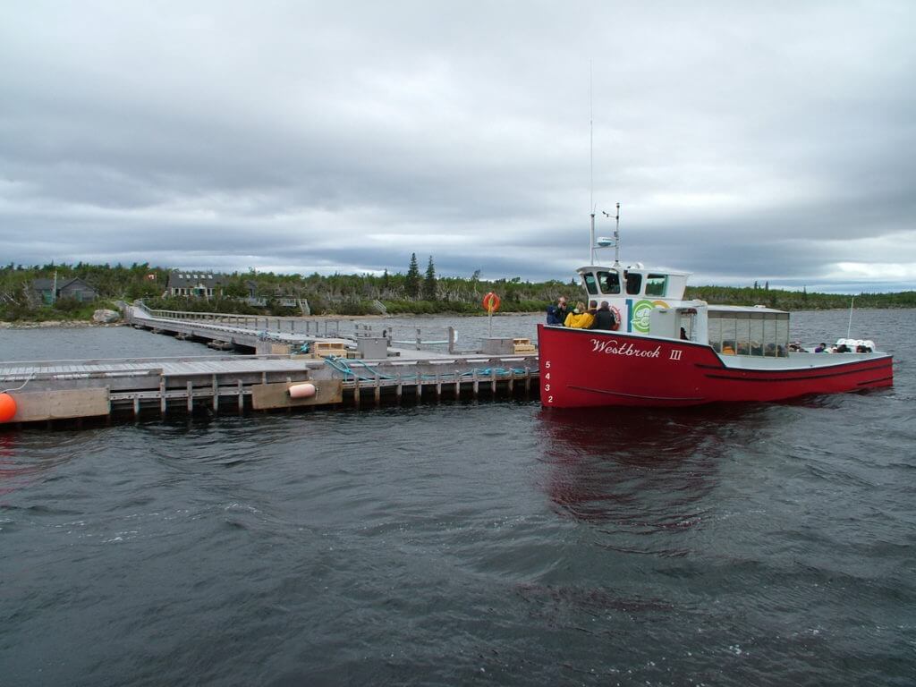tour boat at the dock, western brook pond, gros morne national park, newfoundland, canada