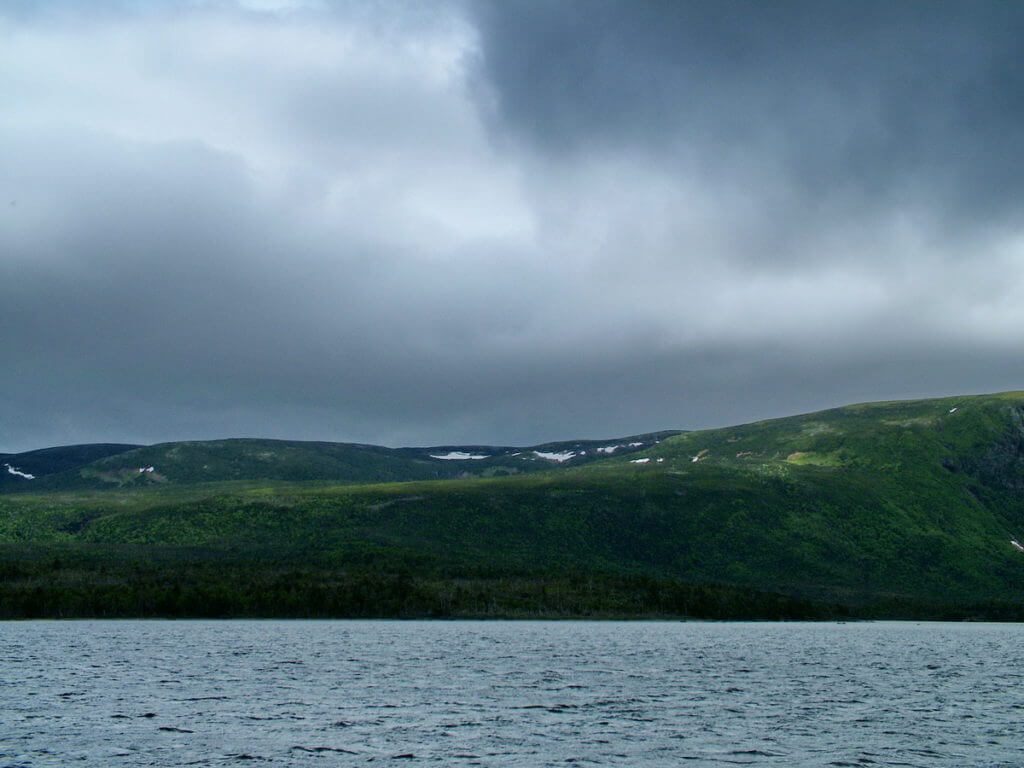 threatening clouds over western brook pond, gros morne national park, newfoundland, canada