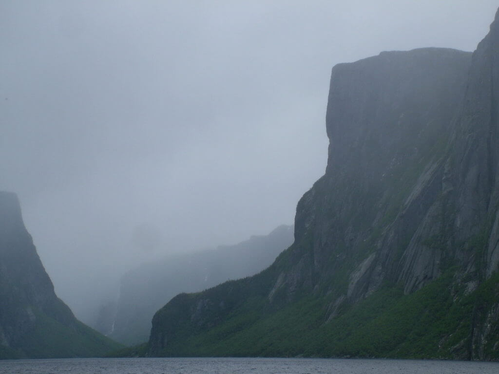 eerily foggy western brook pond, gros morne national park, newfoundland, canada