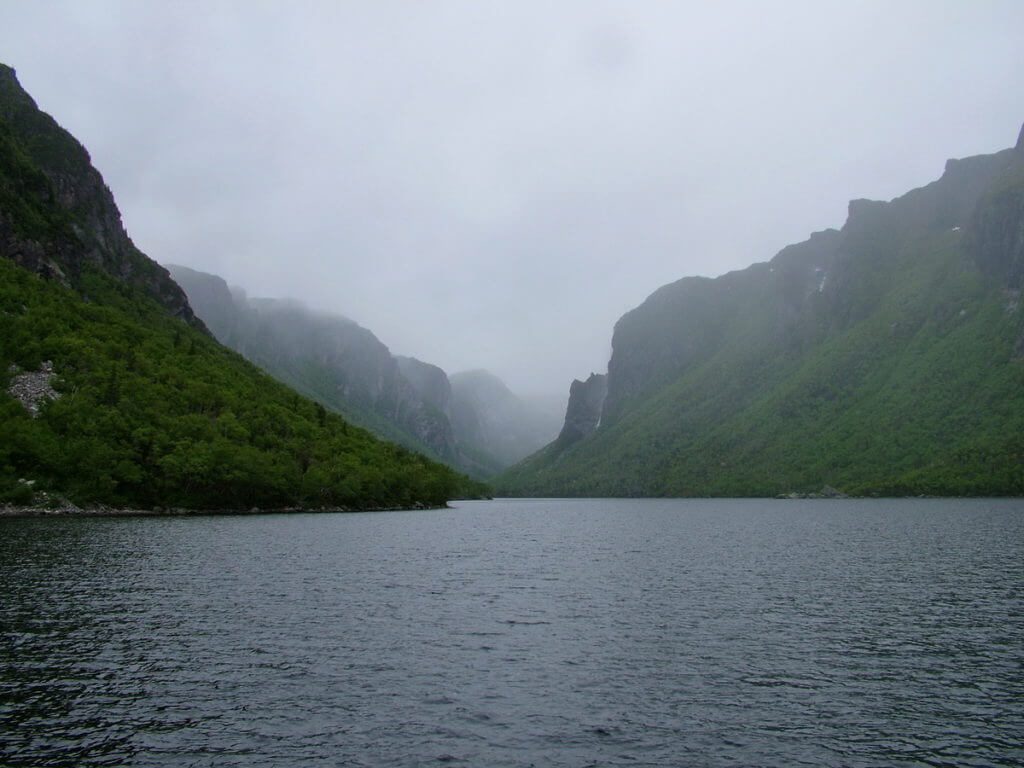 fog over the fjord, western brook pond, gros morne national park, newfoundland, canada
