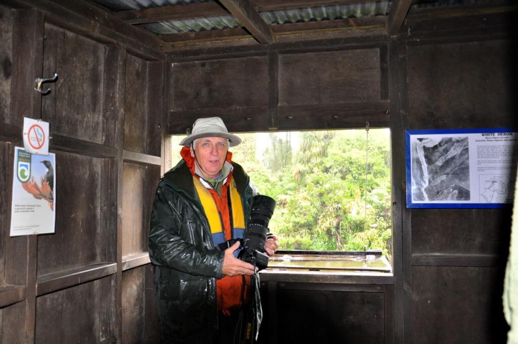 bob inside the bird hide, white heron sanctuary. south island, new zealand
