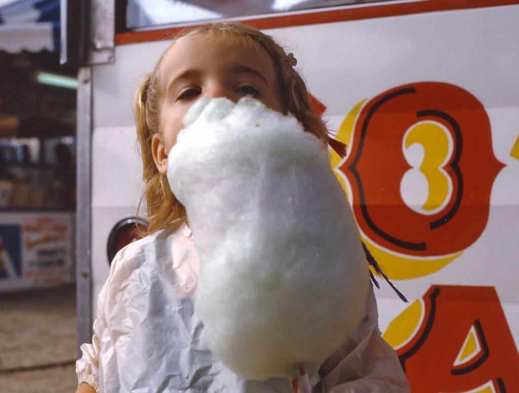 a child eating candy floss, markham fair, 1983