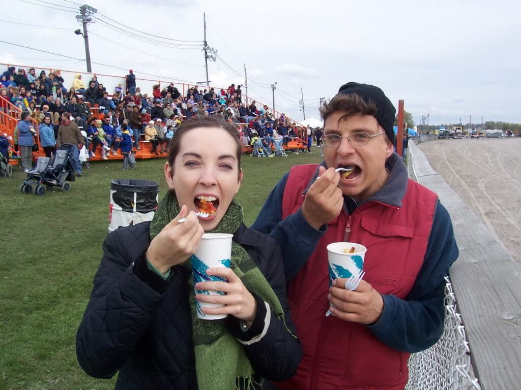 people eating food at the track, markham fair, markham, ontario 2007