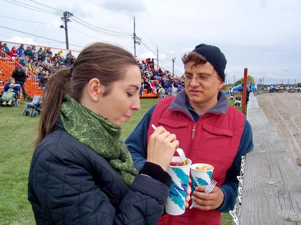 people eating food at the track, markham fair, markham, ontario 2007