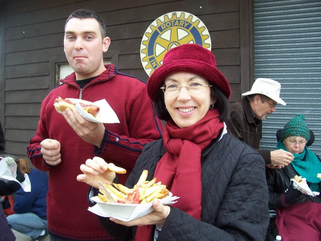 people eating french fries and hot dogs, markham fair, markham, ontario, 2008