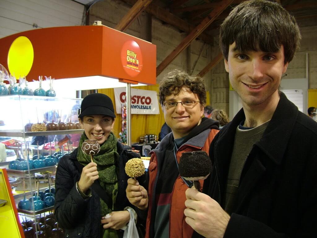 people eating candy apples, markham fair, markham, ontario, 2009