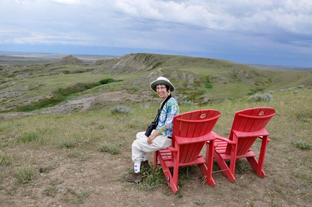 Image of jean sitting at the borderlands lookout, grasslands national park, saskatchewan