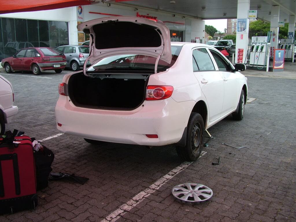 car with flat tire, port elizabeth, south africa