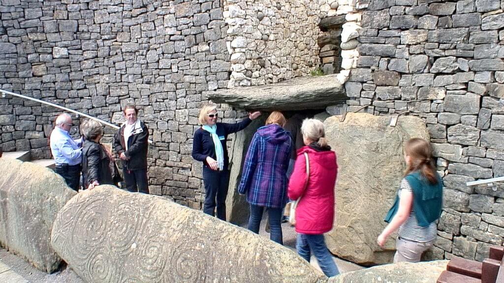 a tour group entering newgrange, county meath, ireland