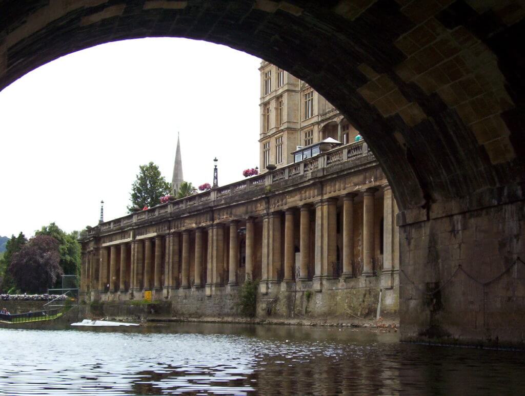 pulteney bridge and empire hotel, avon river, bath, england