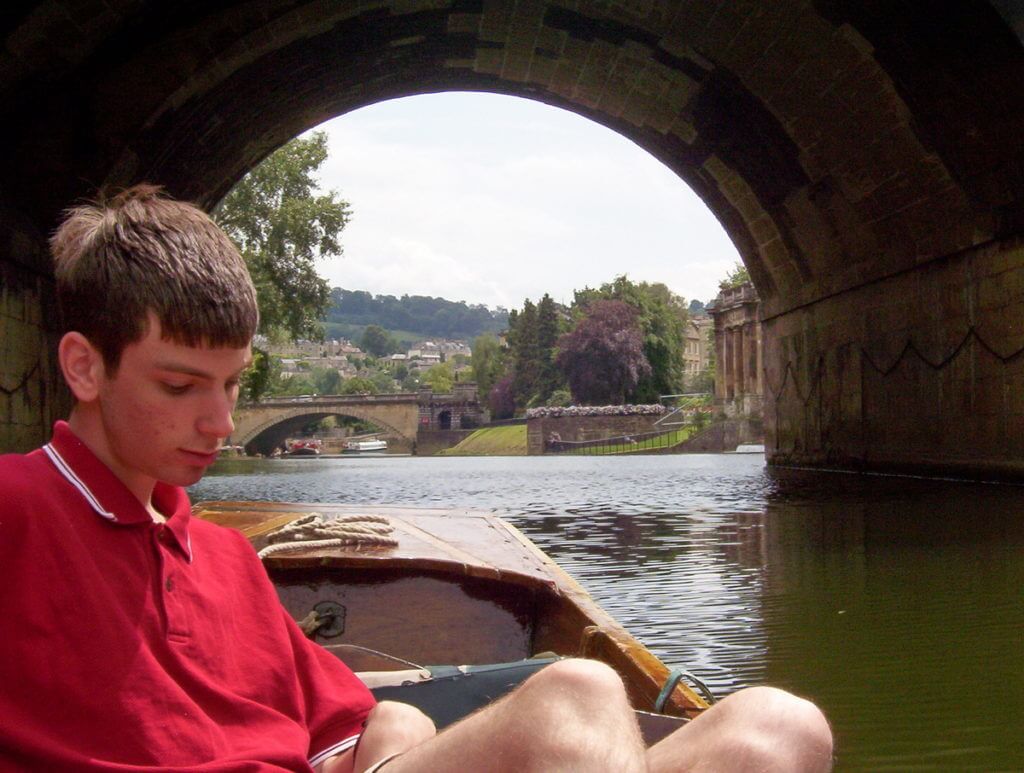 a punt at pulteney bridge, bath, england