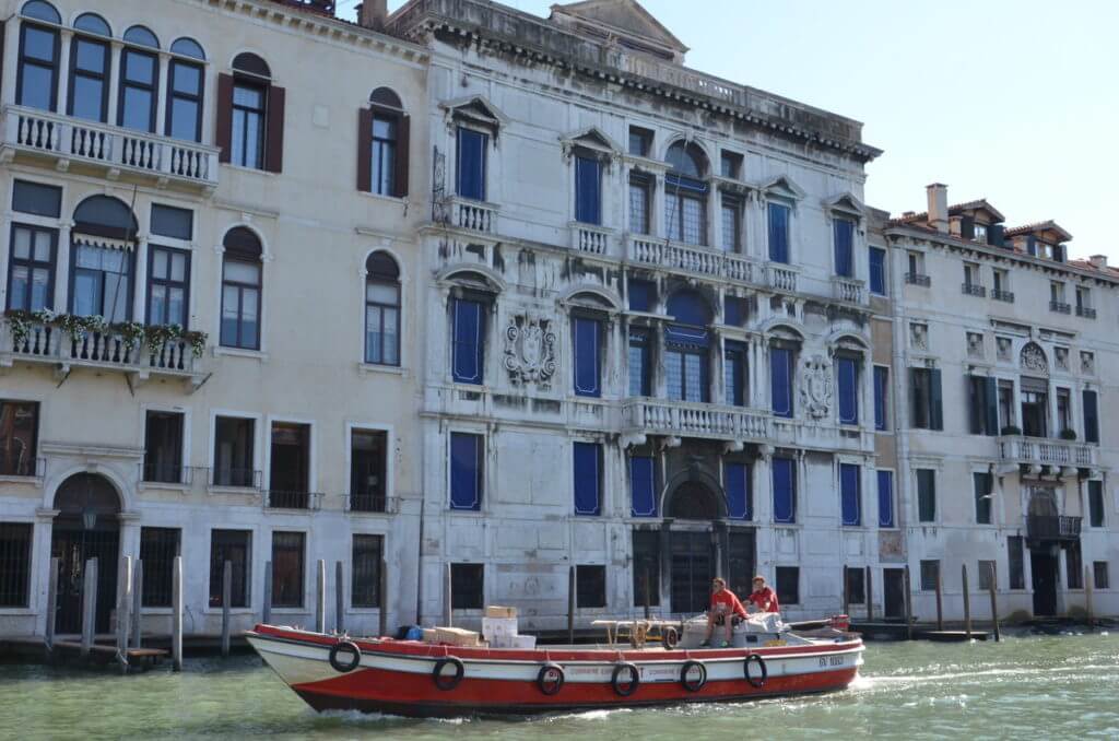 a delivery boat, grand canal, venice, italy