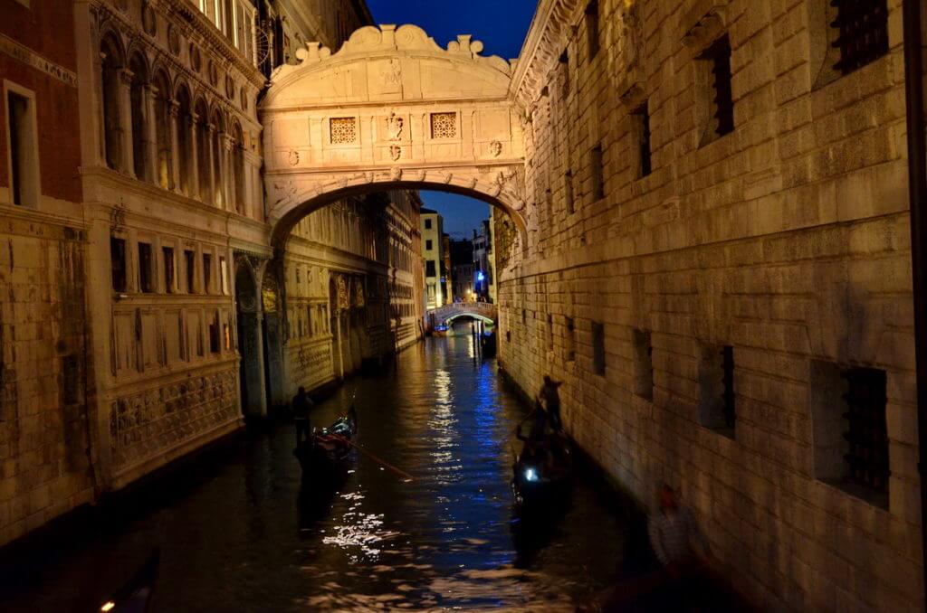 a canal at nighttime, venice, italy