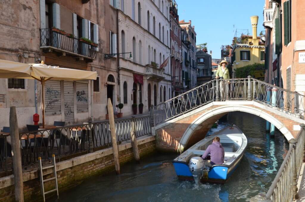 a motorboat on a canal, venice, italy