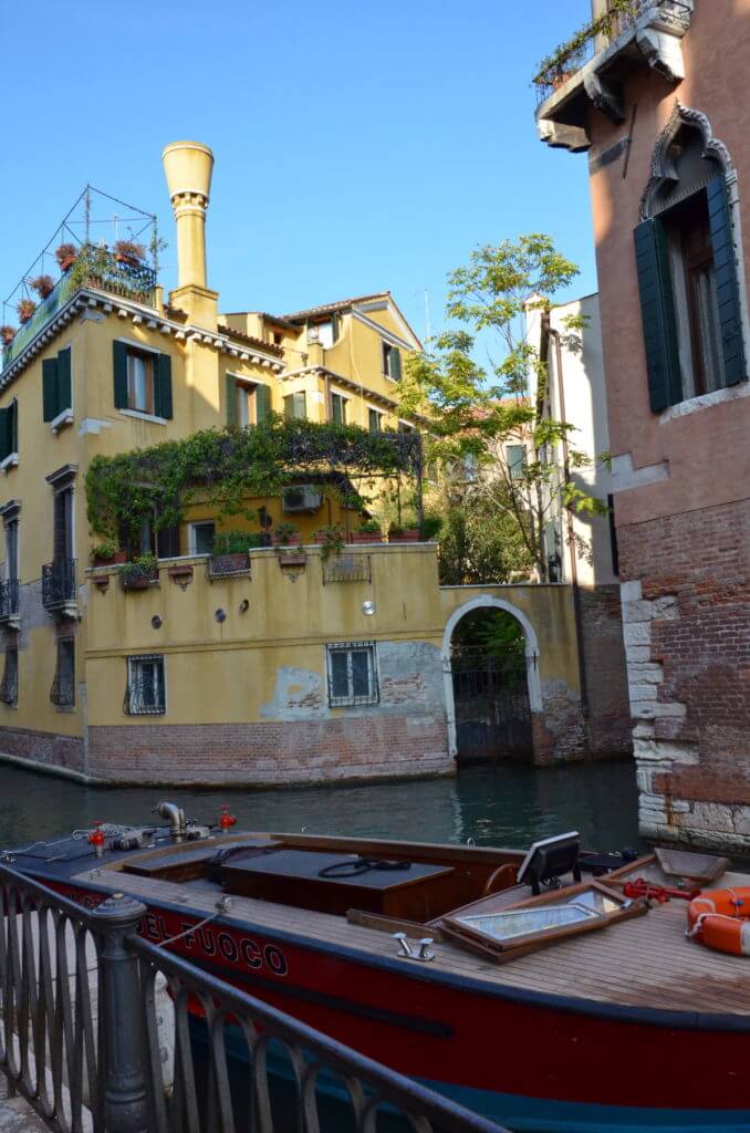 canal-side view of a buildings architecture, venice, italy