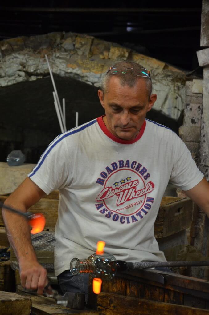 a murano glassmaker, gino mazzuccato glass factory, murano island, venice, italy