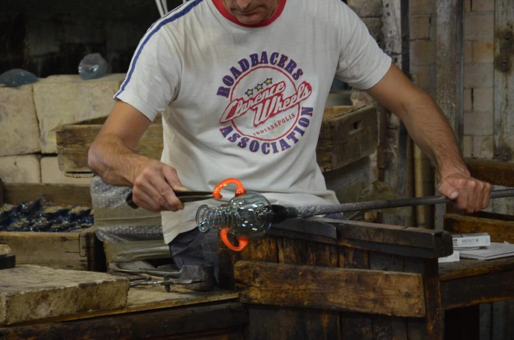 a murano glassmaker, gino mazzuccato glass factory, murano island, venice, italy