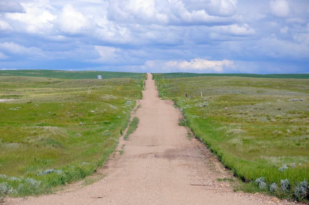 Image of a long dirt road in grasslands national park, saskatchewan
