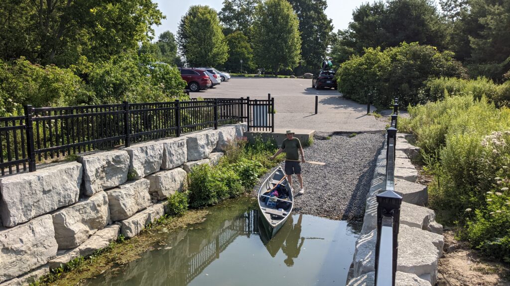 Image of Bob launching canoe on Duffins Creek in Ajax, Ontario, Canada.