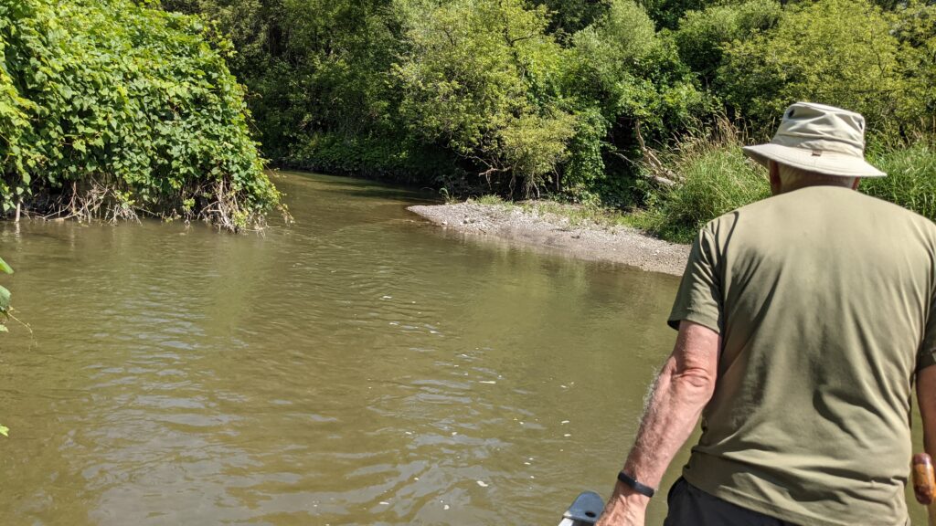 Image of Bob portaging up Duffins Creek in Ajax, Ontario, Canada.