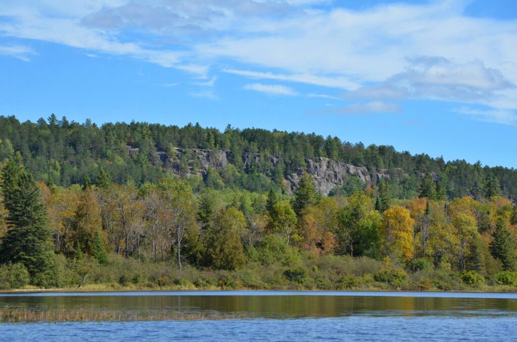 Image of Centennial Ridges Trail Lookout from a canoe on Whitefish Lake in Algonquin Park.