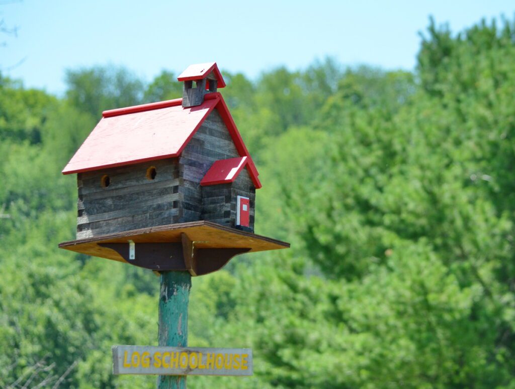 image of log schoolhouse birdhouse, birdhouse city, picton, ontario