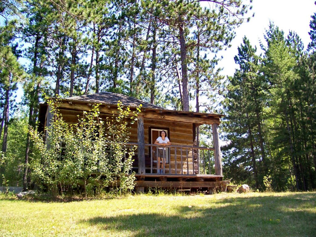 Image of Jean at Tom Thomson cabin at Achray Campground in Algonquin Park.