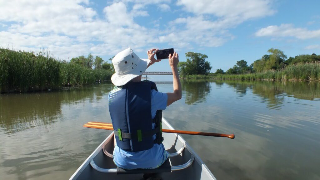 Image of Jean canoeing along Duffins Creek in Ajax, Ontario, Canada.