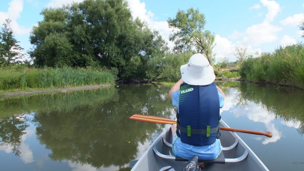 Image of Jean canoeing on Duffins Creek in Ajax, Ontario, Canada.