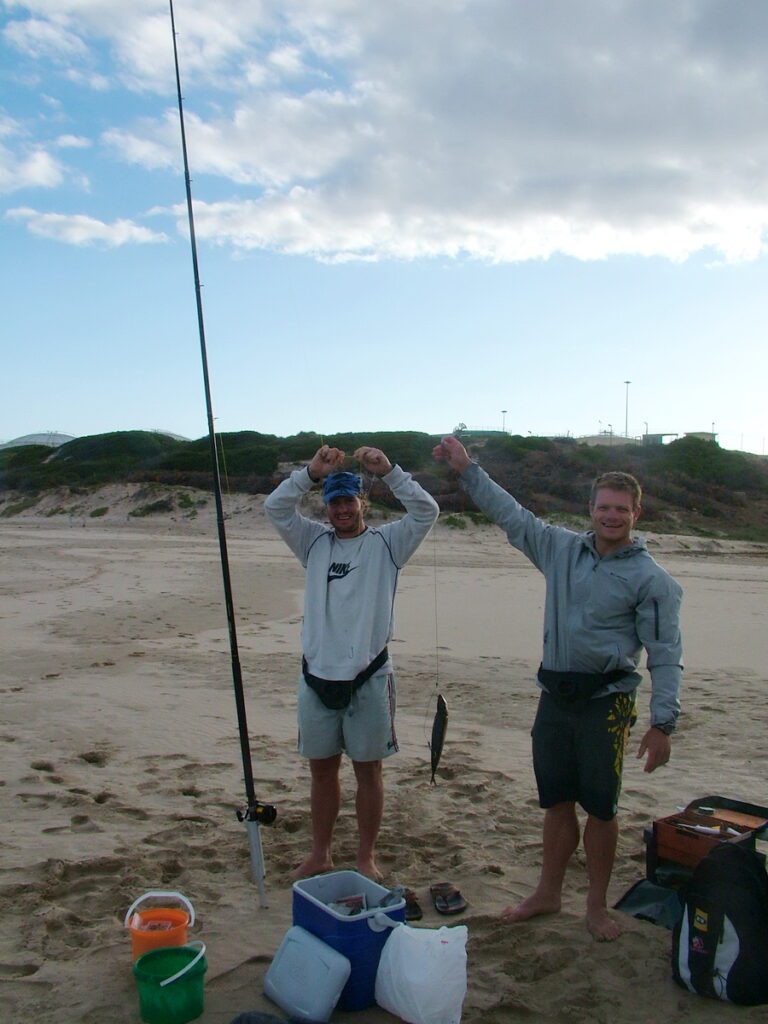 image of fishermen on santos beach, mossel bay, south africa
