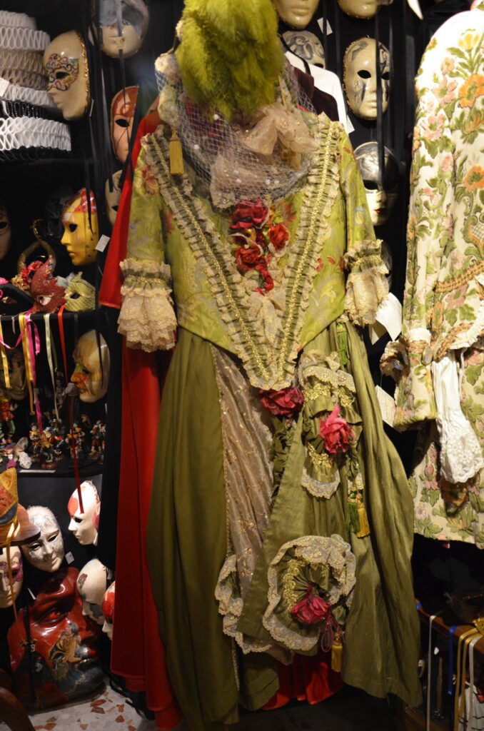 image of a 17th century dress in shop window, venice, italy