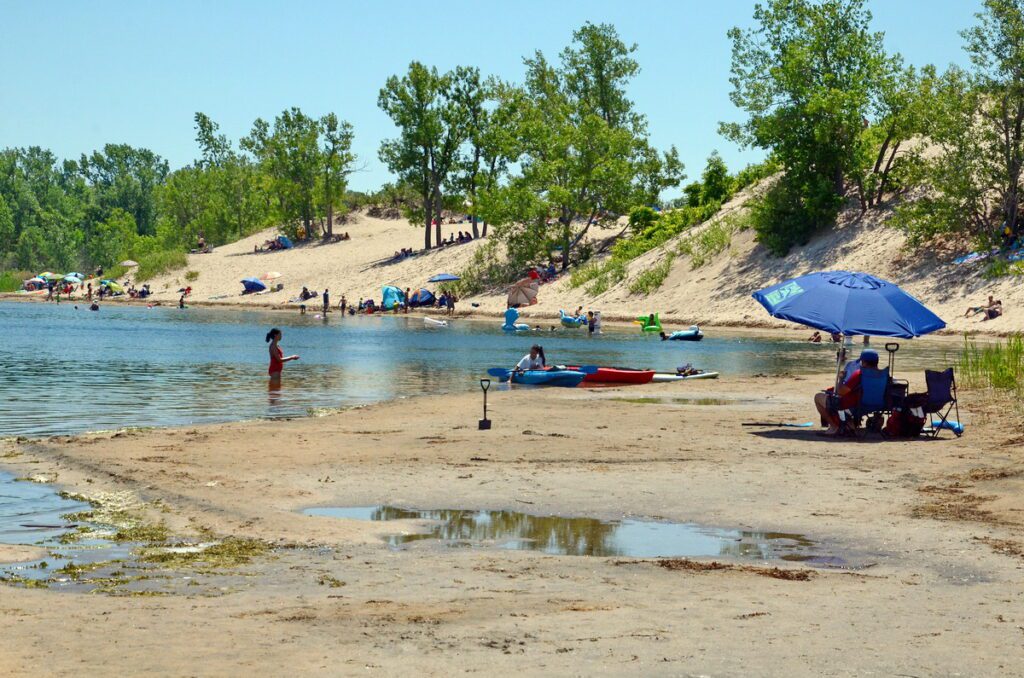 image of beach goers, dunes beach, sandbanks provincial park, ontario