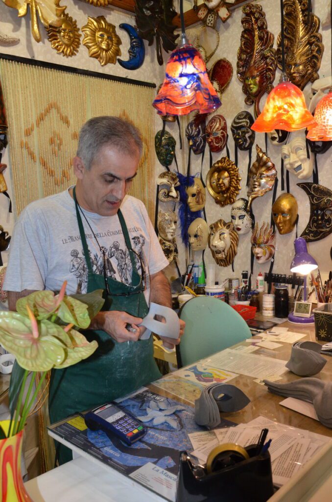 image of a mascherari making a columbina mask, venice, italy