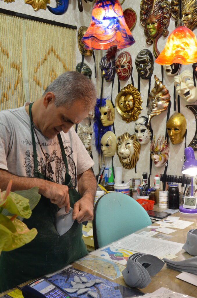 image of a mascherari making a columbina mask, venice, italy