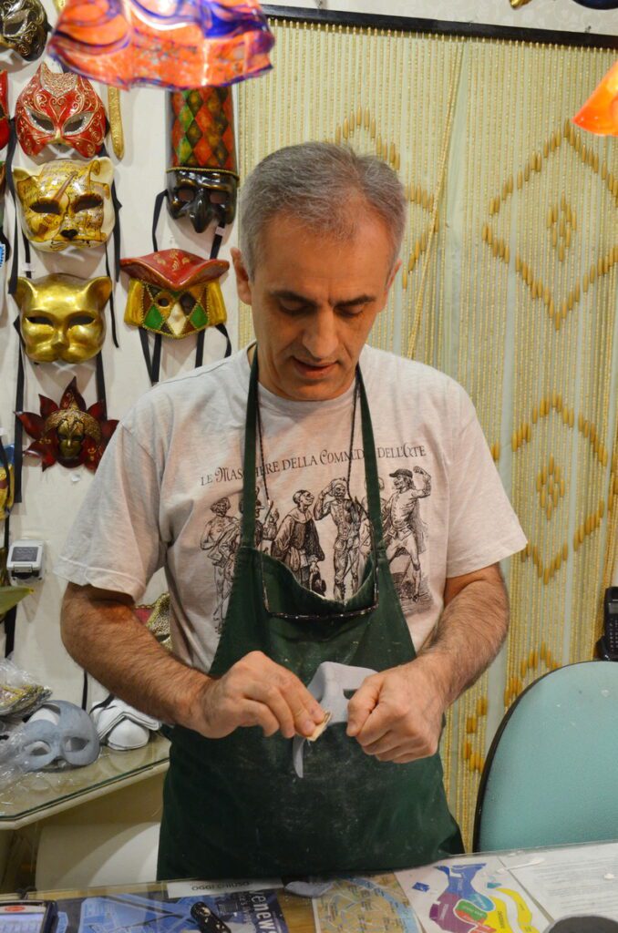 image of a mascherari making a columbina mask, venice, italy