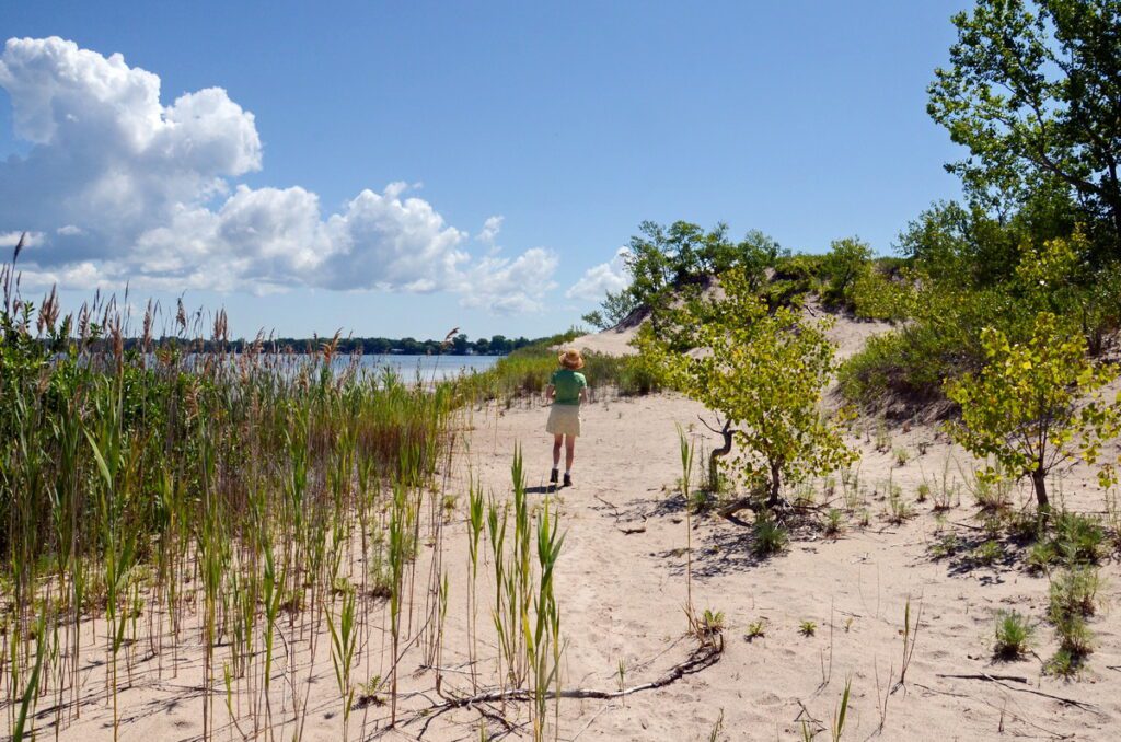 image of jean along shore of west lake, sandbanks provincial park, ontario