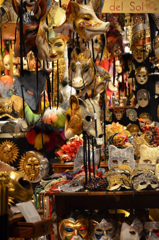 image of venetian masks in a shop window, venice, italy