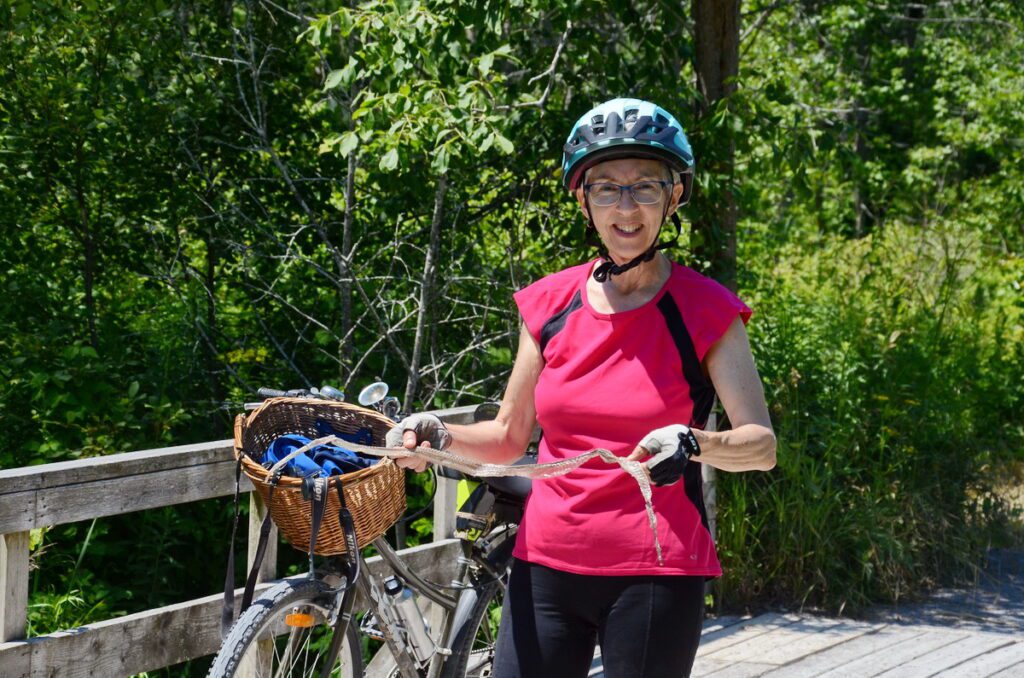 image of jean holding a shed snake skin, millennium trail, prince edward county, ontario