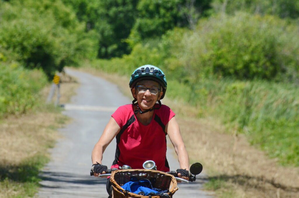 image of jean cycling, millennium trail, prince edward county, ontario