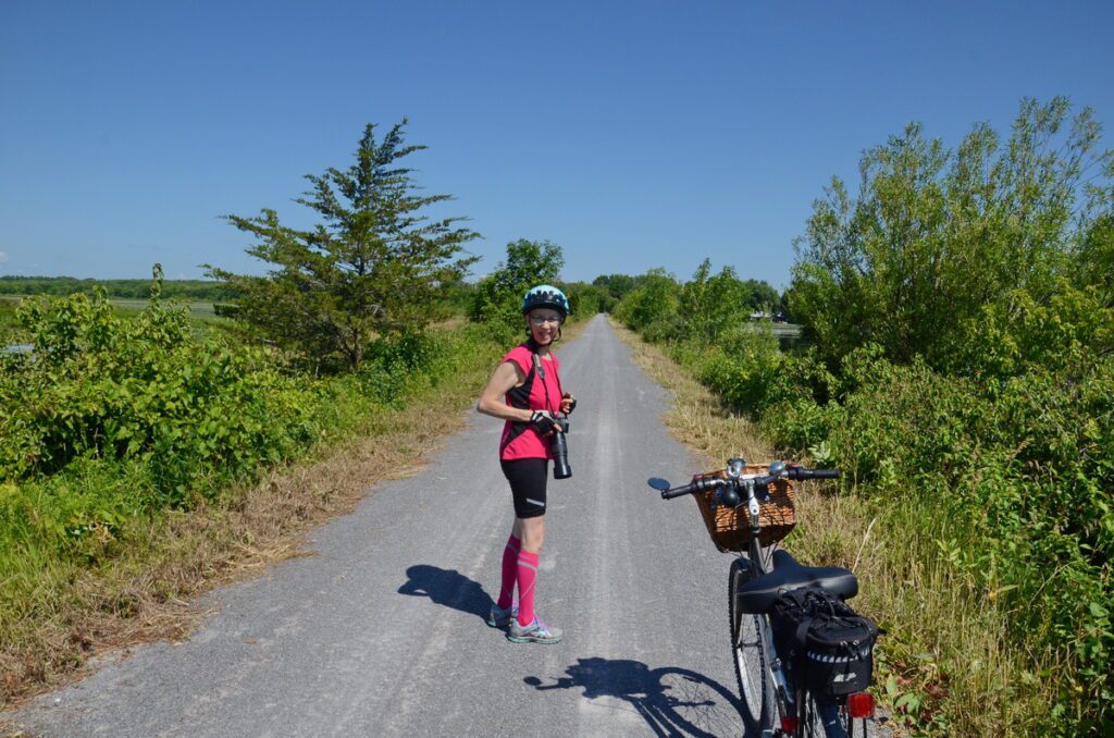 image of jean and her bike, consecon lake, millennium trail, prince edward county, ontario