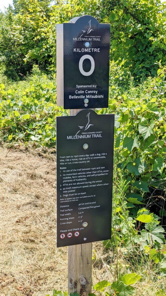 image of kilometre zero sign, carrying place, prince edward county, ontario