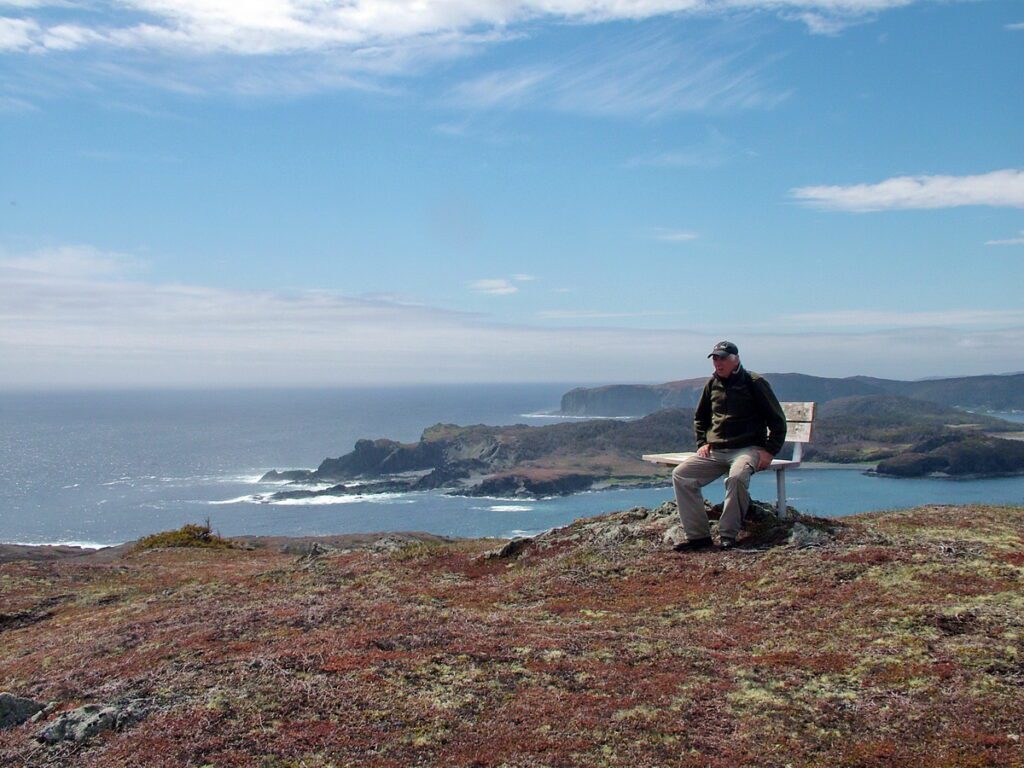 image of bob on a bench, camel's back trail, camel island, newfoundland