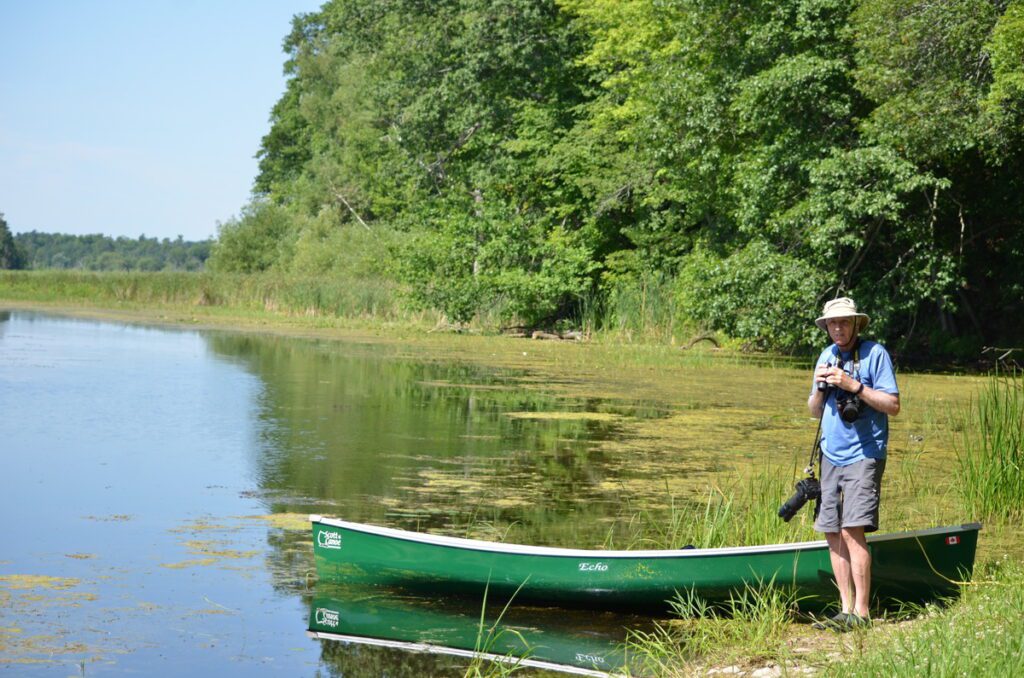 image of bob on the riverbank of black river, prince edward county, ontario