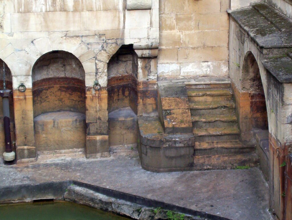 image of benches and steps, sacred spring, roman baths, bath, England 